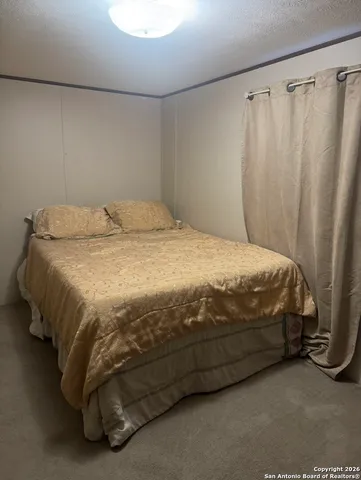 a close up of a bed in a room