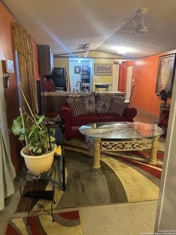 a living room with a couch and a dining table