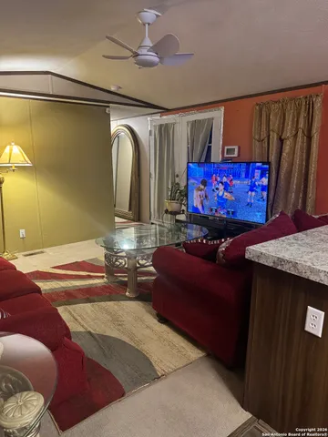 a bedroom with a bed and a mirror