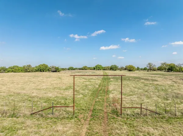 a view of an ocean and yard