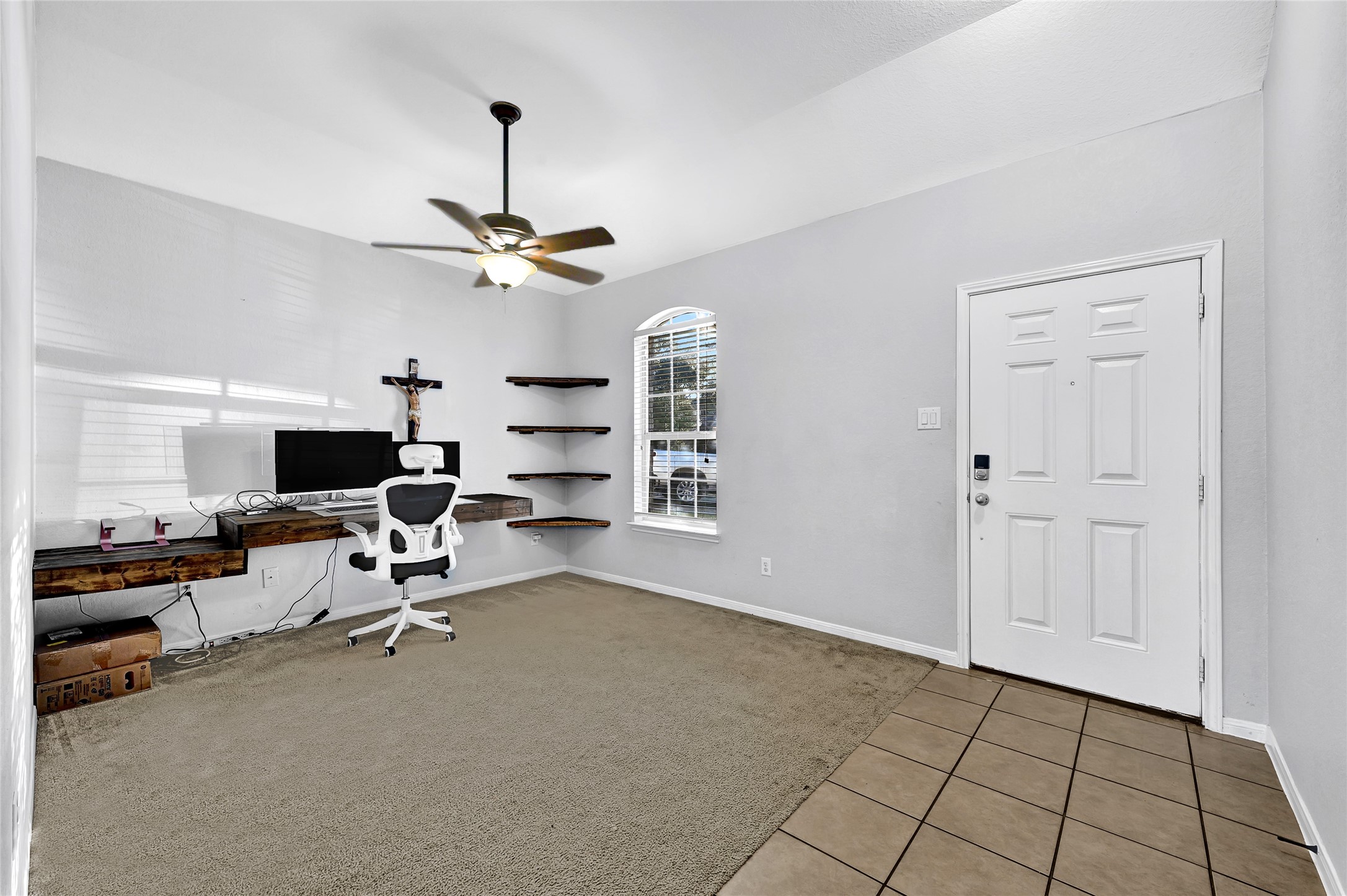 11 Supiro Court Manvel, TX 77578 - Photo 15 of 21 a view of a livingroom with workspace and a window