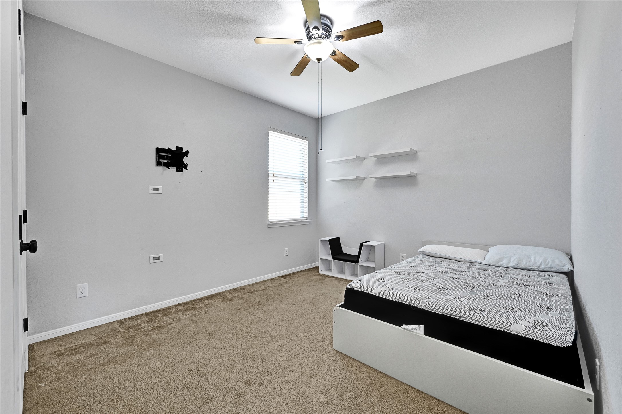 11 Supiro Court Manvel, TX 77578 - Photo 17 of 21 a bedroom with a bed and a chandelier fan