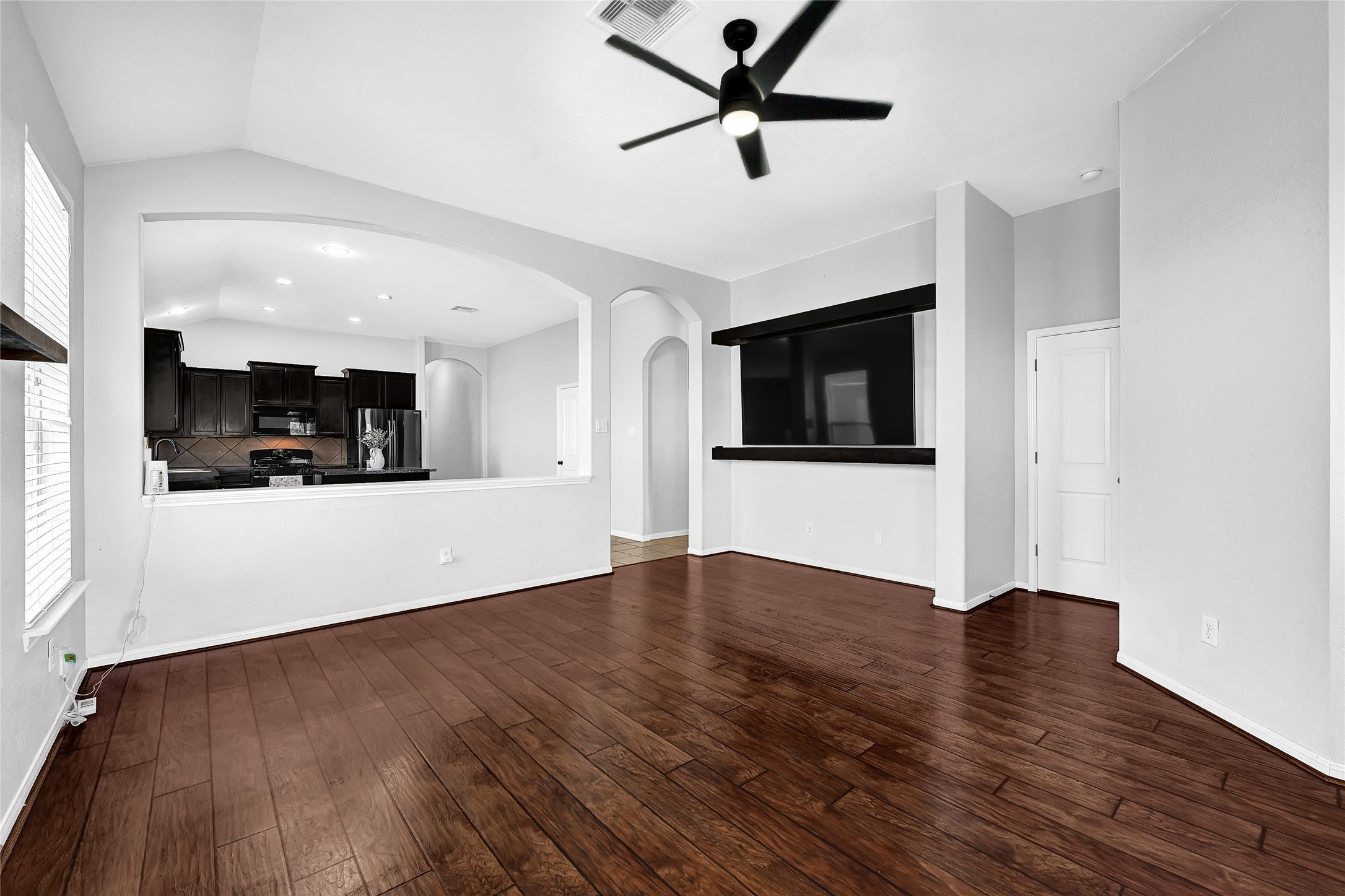 11 Supiro Court Manvel, TX 77578 - Photo 2 of 21 a view of a kitchen with a dishwasher and wooden floor