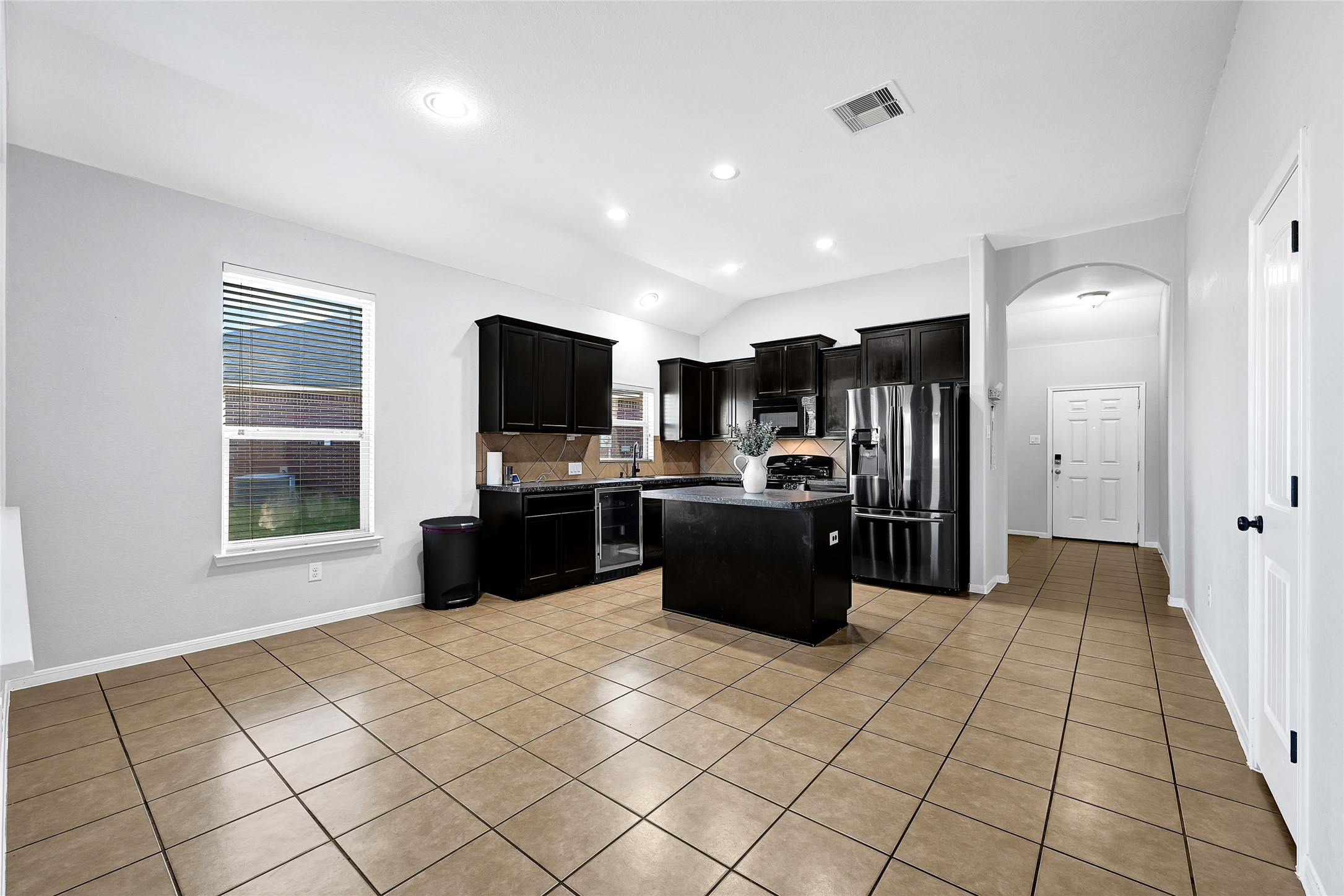 11 Supiro Court Manvel, TX 77578 - Photo 4 of 21 a kitchen with a refrigerator and a sink