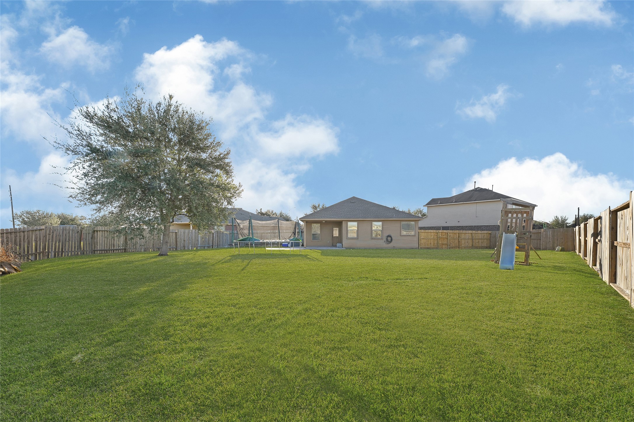 11 Supiro Court Manvel, TX 77578 - Photo 5 of 21 a house view with garden space and trees