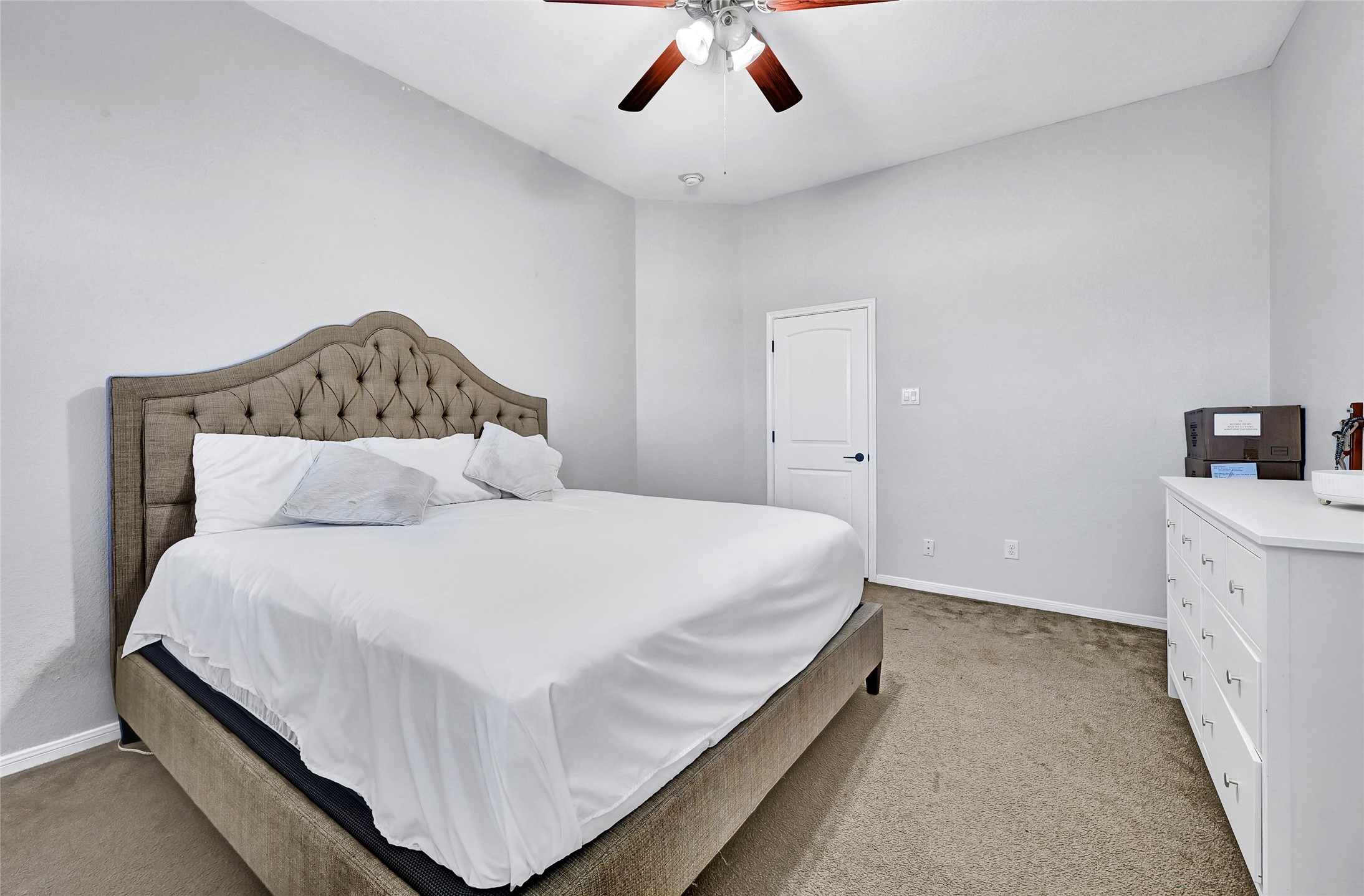 11 Supiro Court Manvel, TX 77578 - Photo 7 of 21 a bed room with a bed and a ceiling fan