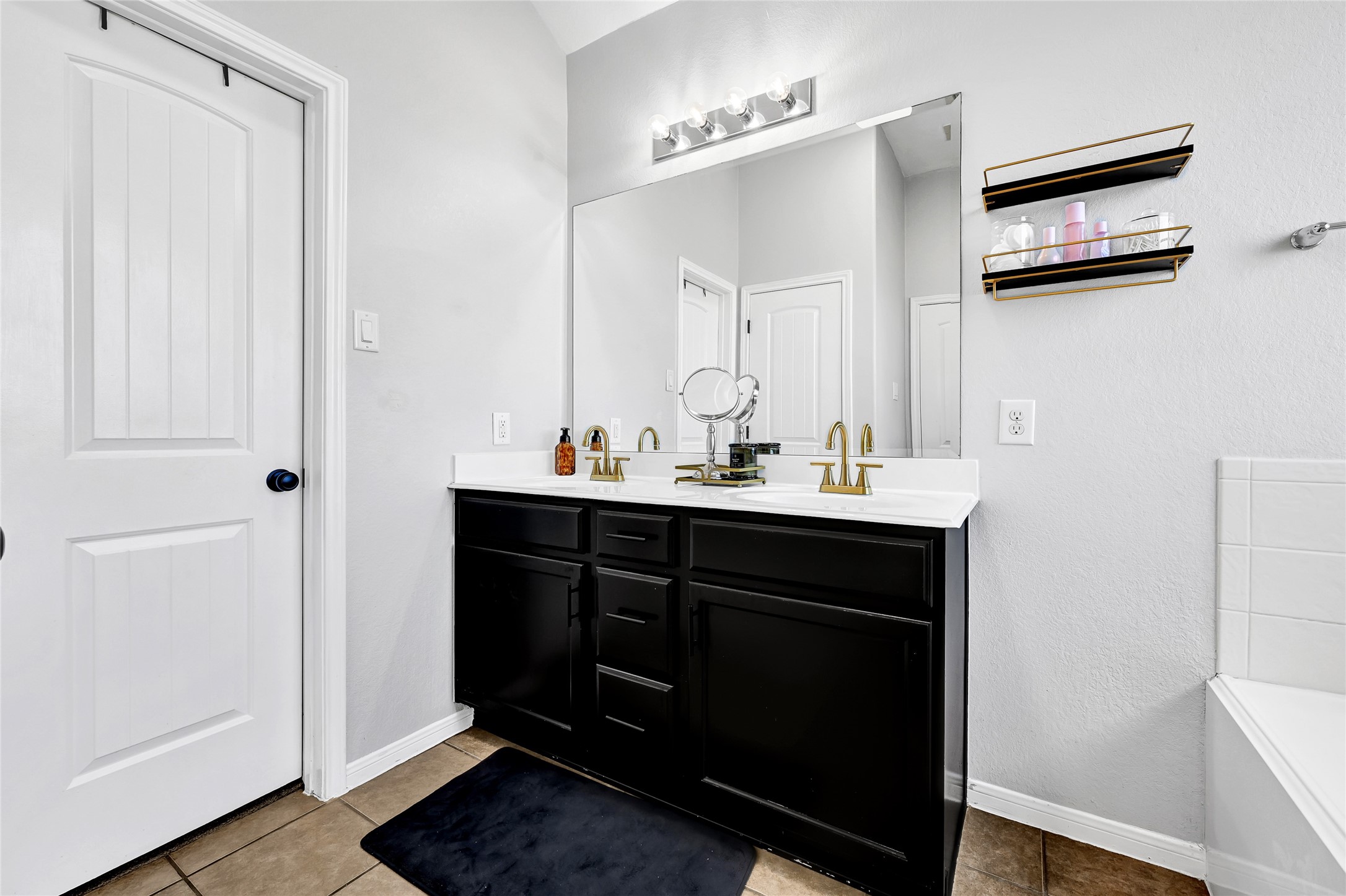 11 Supiro Court Manvel, TX 77578 - Photo 8 of 21 a bathroom with a sink and a mirror