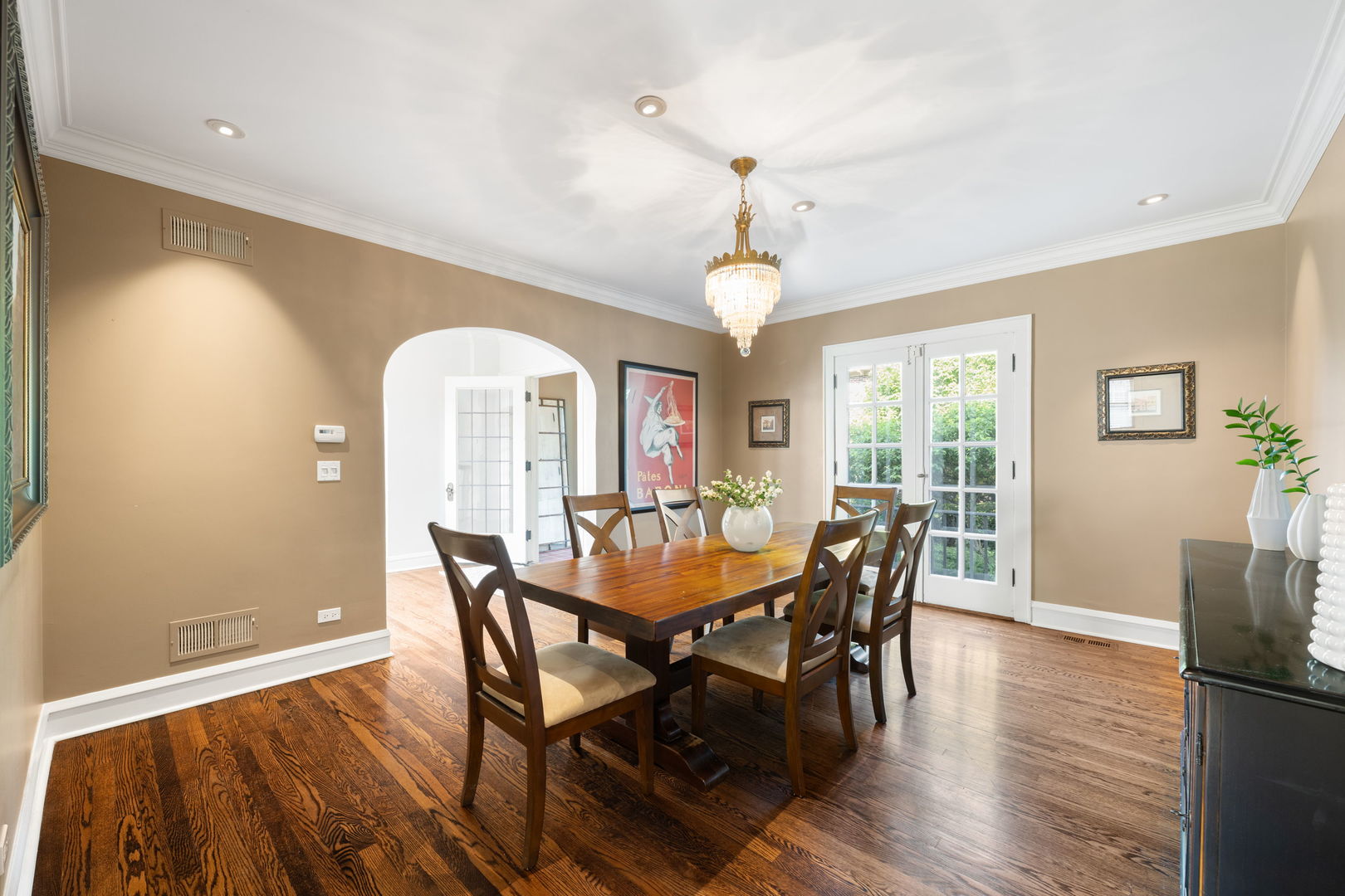 693 Sheridan Road Wilmette, IL 60091 - Photo 13 of 45 a dining room with furniture a chandelier and wooden floor