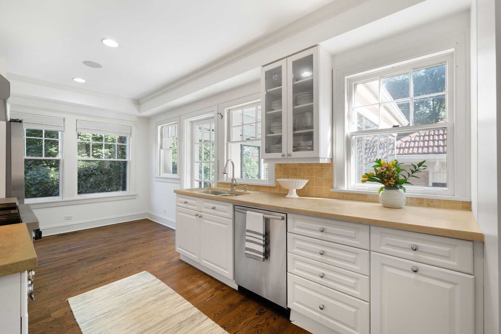 693 Sheridan Road Wilmette, IL 60091 - Photo 14 of 45 a spacious bathroom with double vanity a large window a bathtub and two mirrors