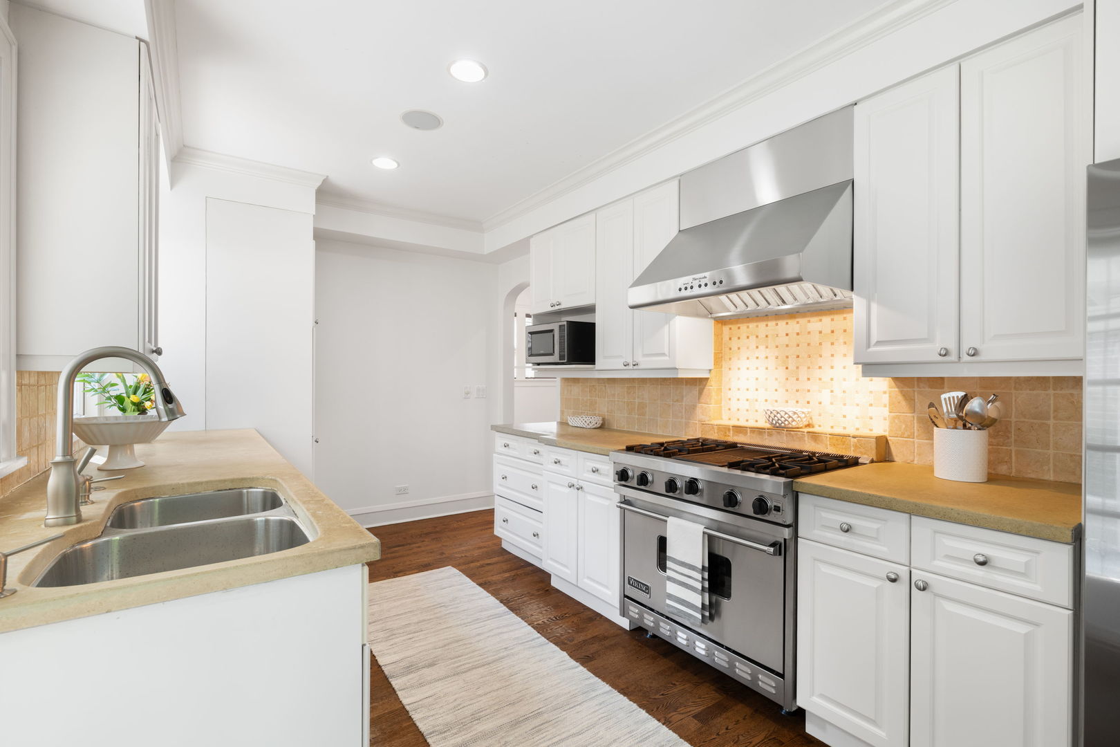 693 Sheridan Road Wilmette, IL 60091 - Photo 15 of 45 a kitchen with stainless steel appliances granite countertop a stove and a sink