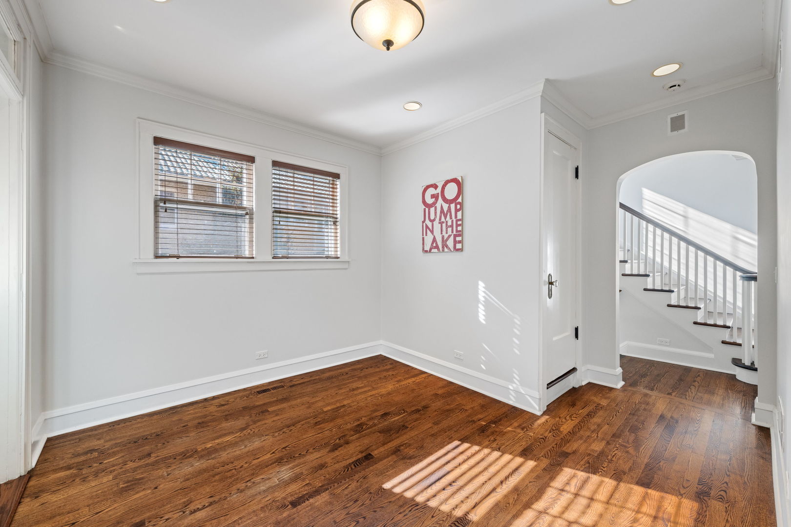 693 Sheridan Road Wilmette, IL 60091 - Photo 16 of 45 a view of an empty room with wooden floor and a window