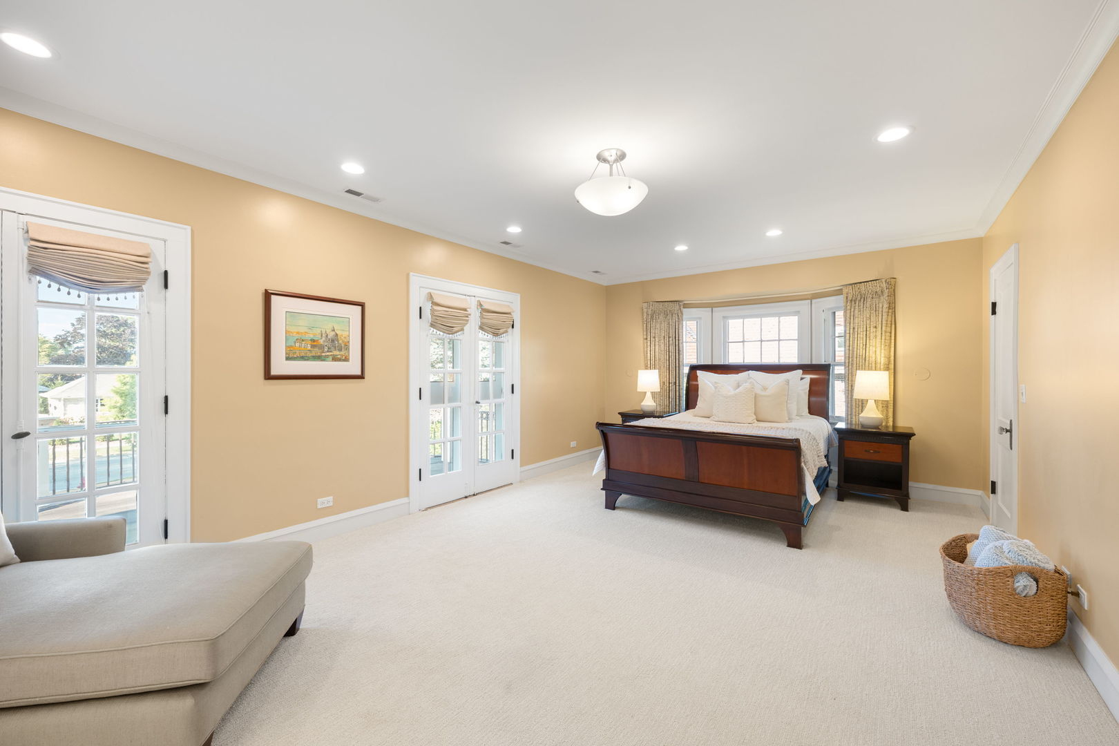 693 Sheridan Road Wilmette, IL 60091 - Photo 17 of 45 a spacious bedroom with a bed and a couch