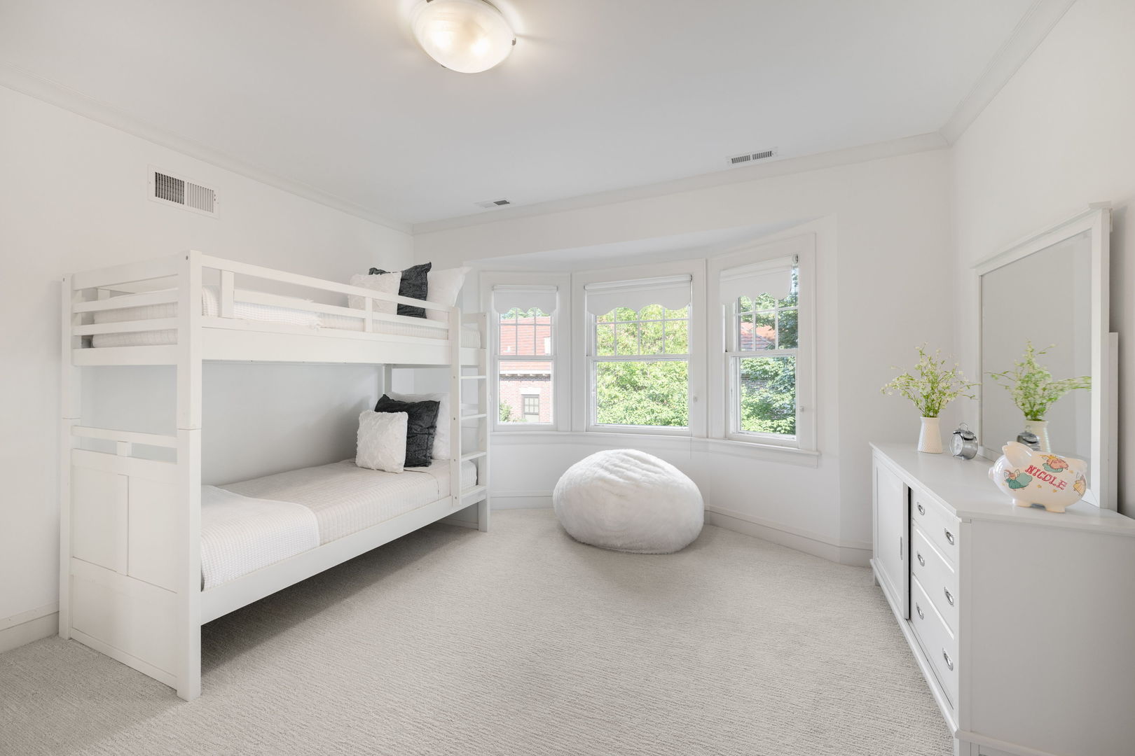 693 Sheridan Road Wilmette, IL 60091 - Photo 20 of 45 a bedroom with a bed and a large window