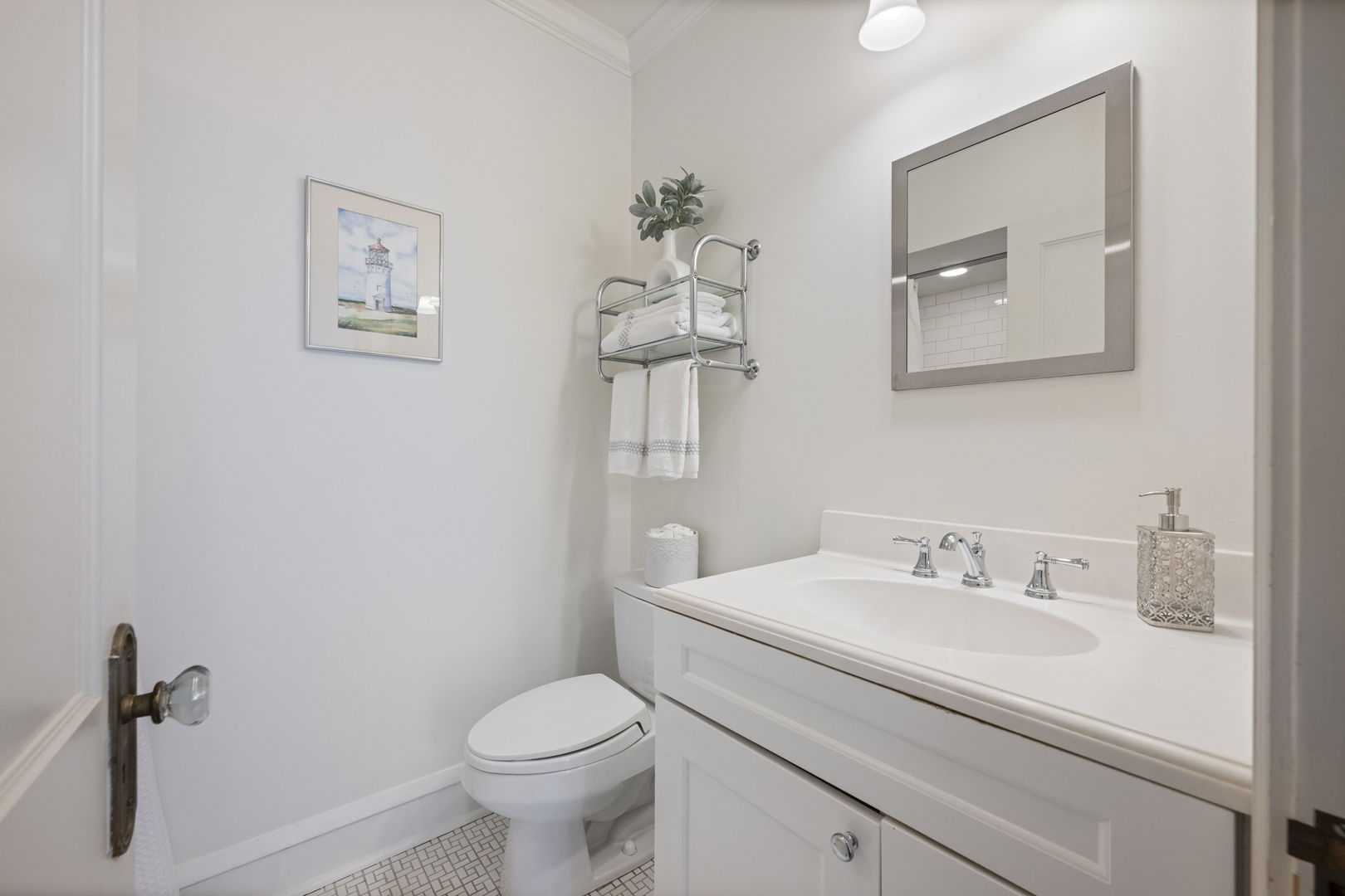693 Sheridan Road Wilmette, IL 60091 - Photo 26 of 45 a bathroom with a toilet sink and mirror