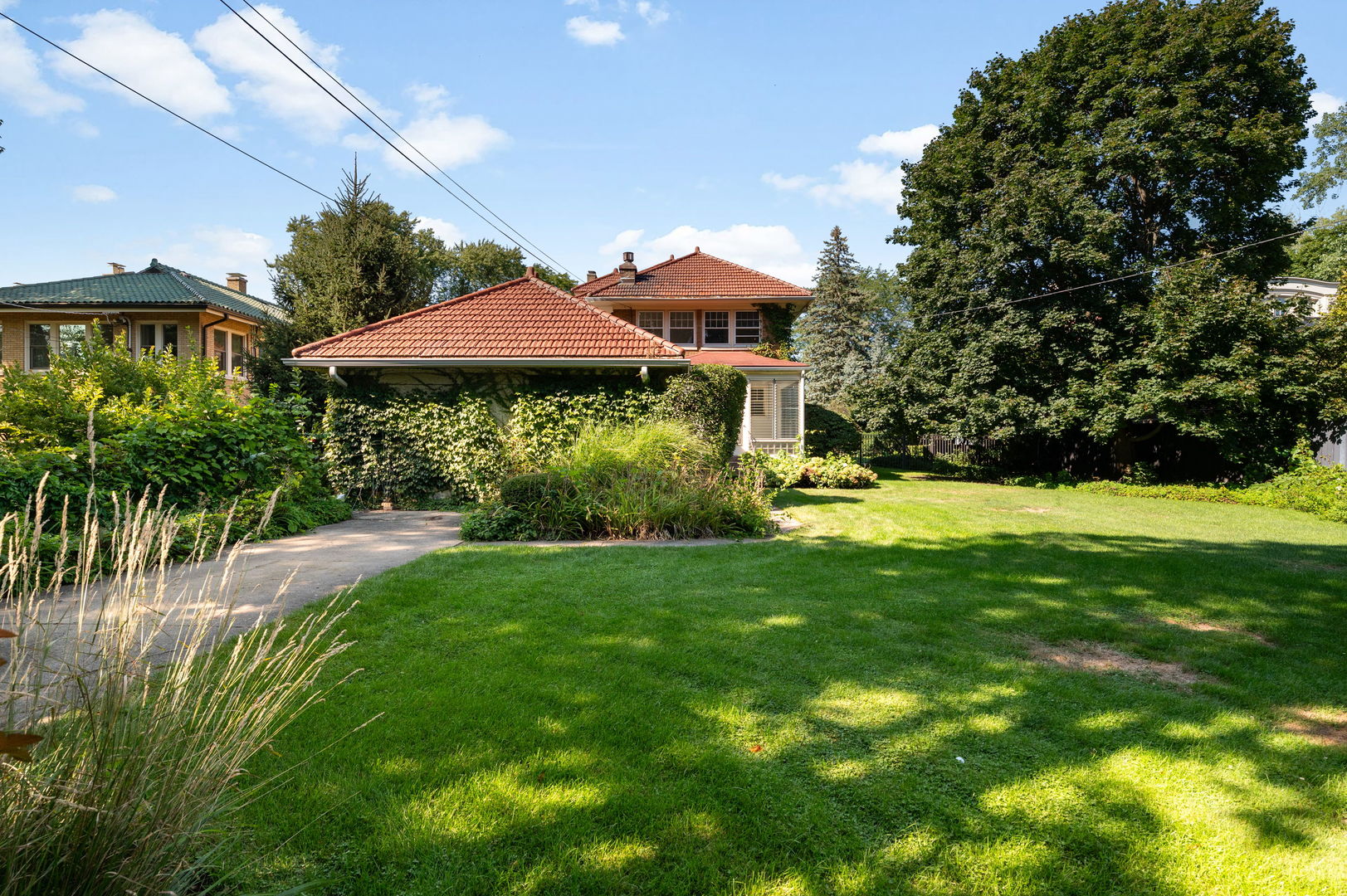 693 Sheridan Road Wilmette, IL 60091 - Photo 35 of 45 a view of a house with a yard and sitting area