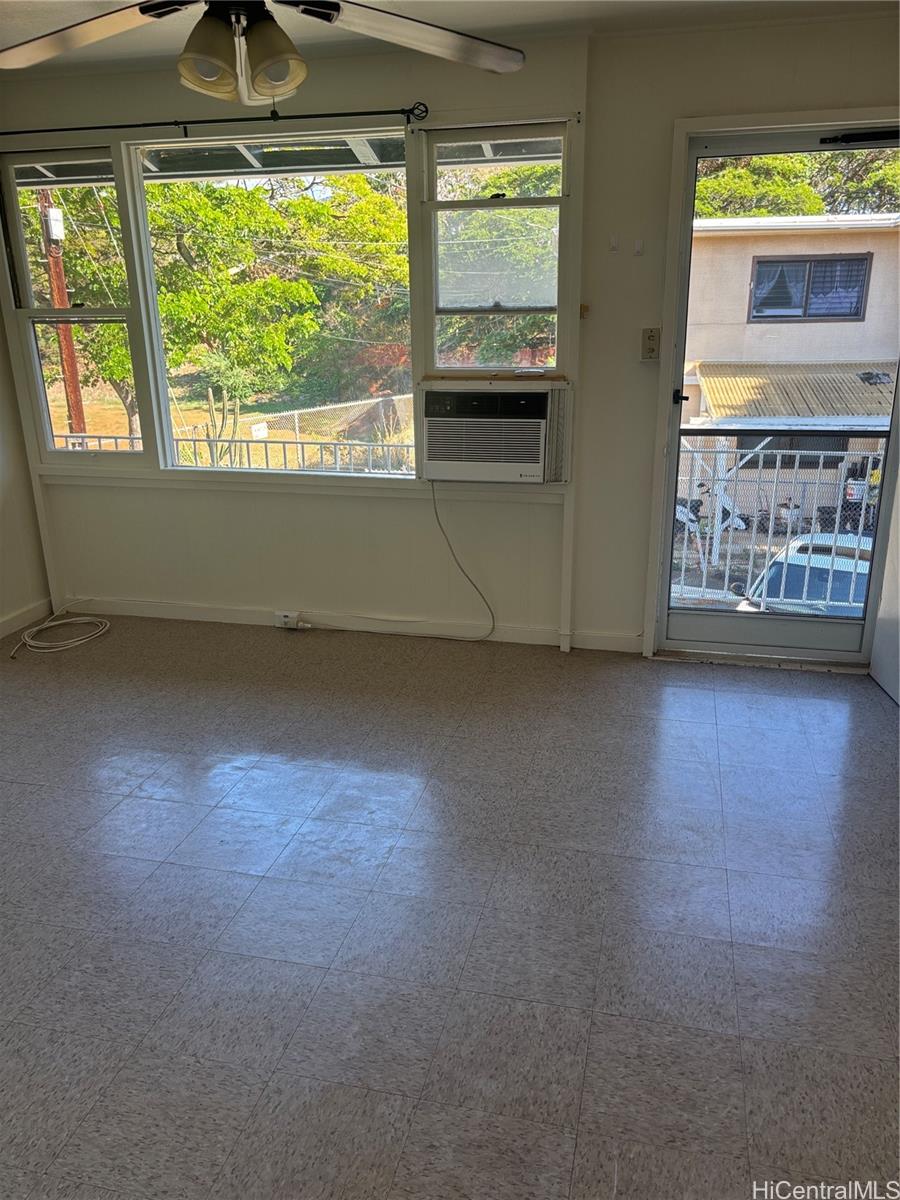 2904 Varsity Circle, Unit 3 Honolulu, HI 96826 - Photo 3 of 5 an empty room with windows lake and mountain view