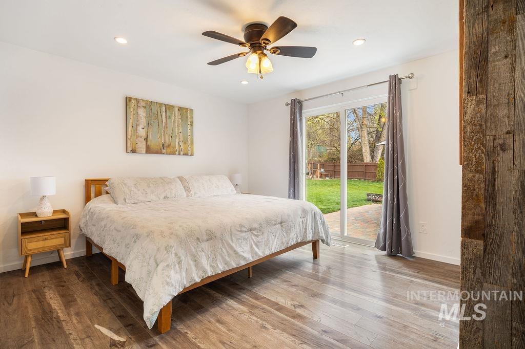 405 North 2nd Street Eagle, ID 83616 - Photo 13 of 39 Bedroom featuring access to outside, wood-type flooring, a ceiling fan, and recessed lighting