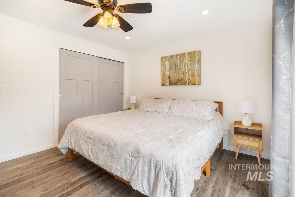 405 North 2nd Street Eagle, ID 83616 - Photo 14 of 39 Bedroom featuring a closet, wood finished floors, recessed lighting, and ceiling fan