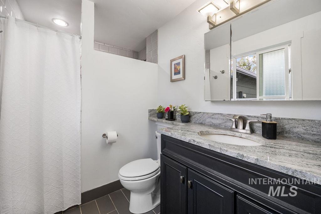 405 North 2nd Street Eagle, ID 83616 - Photo 15 of 39 Full bathroom featuring vanity and curtained shower