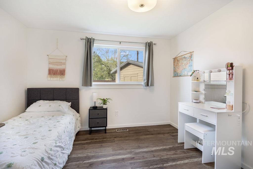 405 North 2nd Street Eagle, ID 83616 - Photo 17 of 39 Bedroom featuring dark wood-type flooring and baseboards