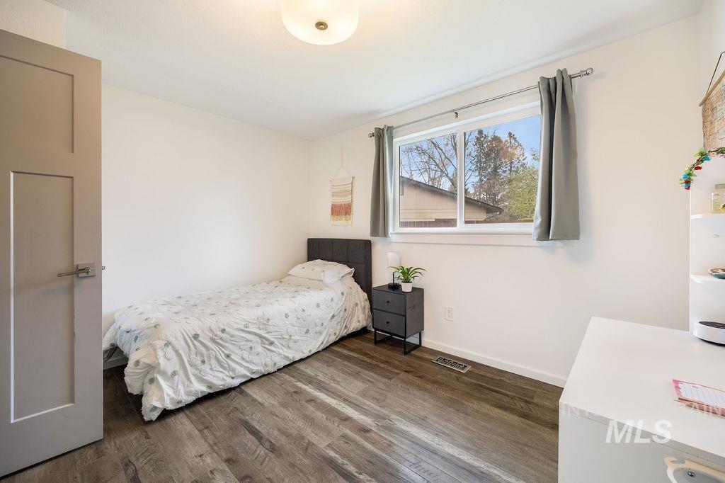 405 North 2nd Street Eagle, ID 83616 - Photo 19 of 39 Bedroom featuring dark wood-style floors and baseboards