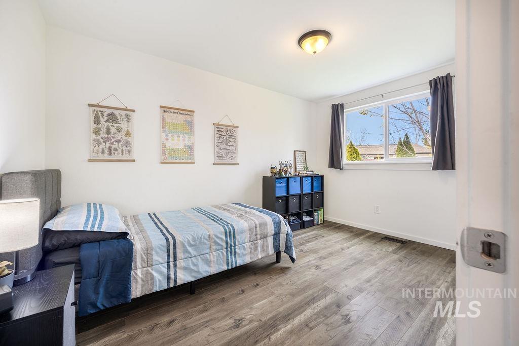 405 North 2nd Street Eagle, ID 83616 - Photo 20 of 39 Bedroom with wood finished floors and baseboards