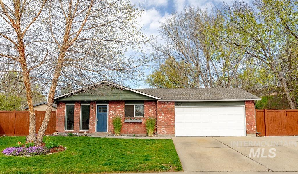 405 North 2nd Street Eagle, ID 83616 - Photo 2 of 39 Ranch-style house with a garage, concrete driveway, brick siding, and a shingled roof