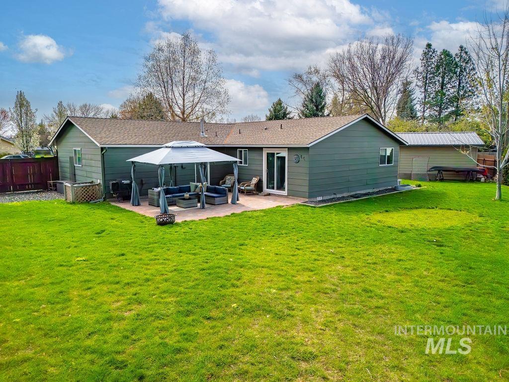 405 North 2nd Street Eagle, ID 83616 - Photo 24 of 39 Back of house featuring an outdoor hangout area, a lawn, a patio, and a gazebo