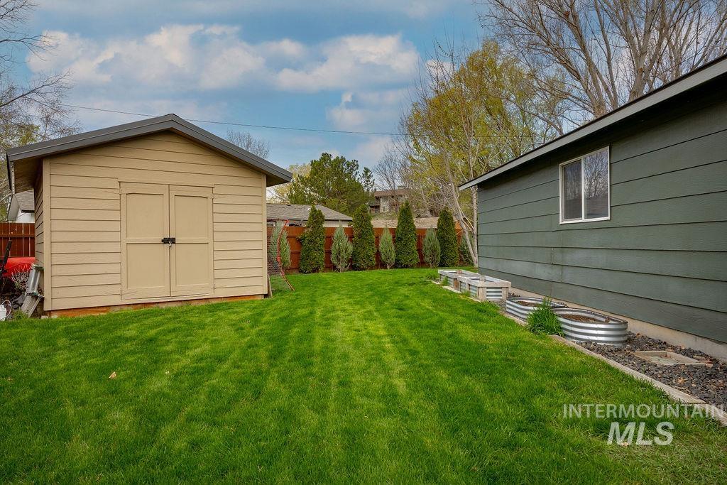 405 North 2nd Street Eagle, ID 83616 - Photo 28 of 39 Fenced backyard featuring a storage shed