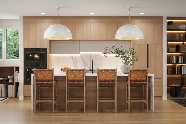 a kitchen with stainless steel appliances a dining table chairs and a refrigerator