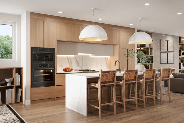 a kitchen with stainless steel appliances granite countertop a stove refrigerator and cabinets