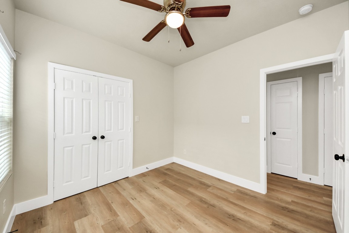 5211 Amy Street, Unit B Houston, TX 77028 - Photo 12 of 17 a view of empty room with wooden floor and fan