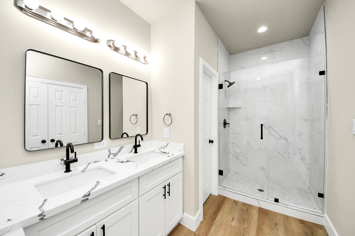 5211 Amy Street, Unit B Houston, TX 77028 - Photo 14 of 17 a bathroom with a tub sink mirror and shower