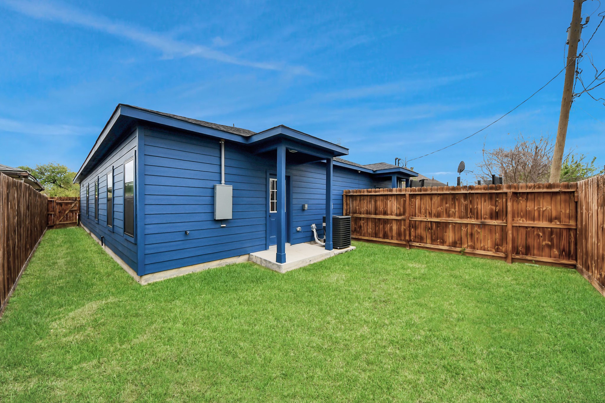 5211 Amy Street, Unit B Houston, TX 77028 - Photo 17 of 17 a view of a backyard with potted plants and wooden fence