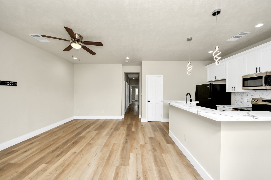 5211 Amy Street, Unit B Houston, TX 77028 - Photo 3 of 17 a view of a living room with a flat screen tv