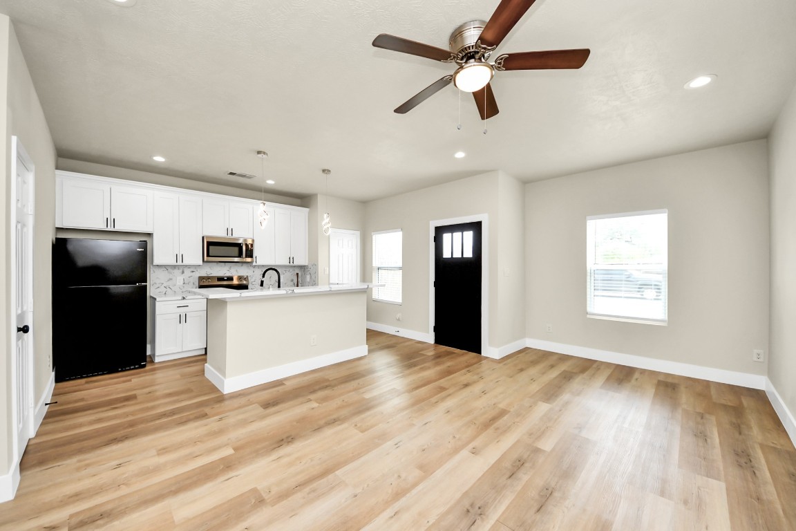 5211 Amy Street, Unit B Houston, TX 77028 - Photo 4 of 17 a view of kitchen with granite countertop cabinets and refrigerator