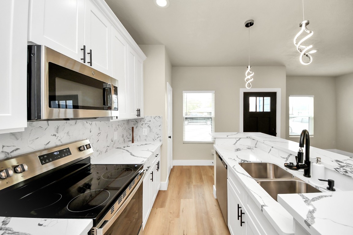 5211 Amy Street, Unit B Houston, TX 77028 - Photo 7 of 17 a kitchen with a sink stove and microwave