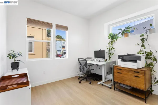 a workspace with furniture and a potted plant