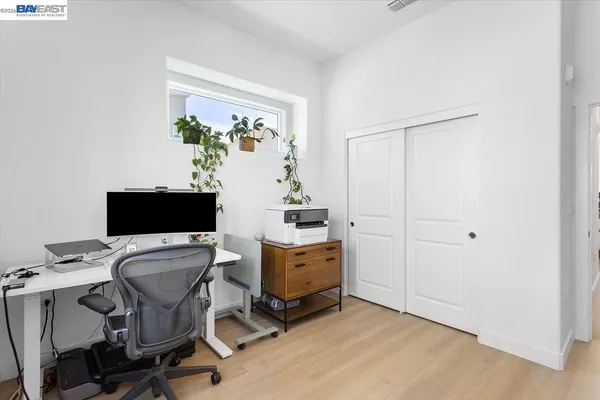 a view of workspace with wooden floor shelves