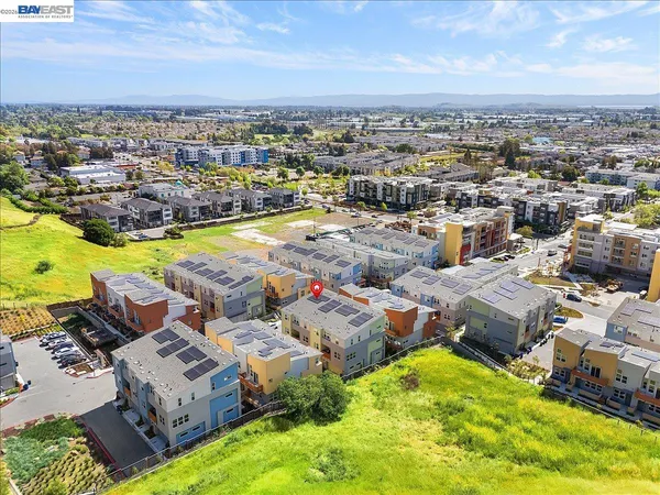 an aerial view of a swimming pool with outdoor space