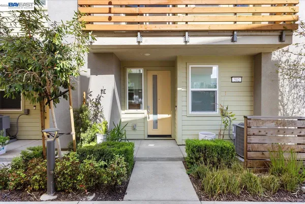 a view of a pathway besides a house