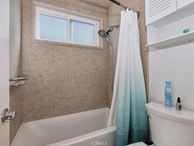 a bathroom with a sink a toilet and a bathtub