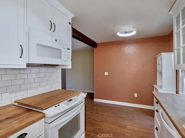 a kitchen with a stove and a microwave