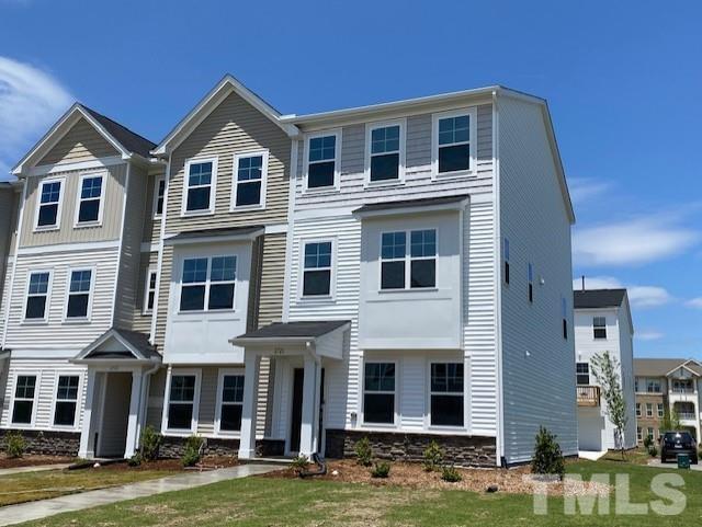 2720 Chert Lane Raleigh, NC 27610 - Photo 1 of 20 a front view of a house with a yard