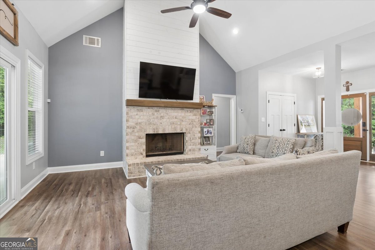 683 Teagle Road Forsyth, GA 31029 - Photo 17 of 50 a living room with furniture fireplace and flat screen tv