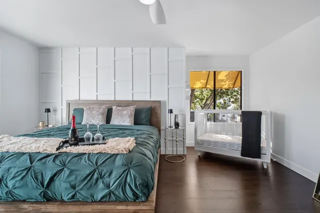 a bedroom with a bed and window