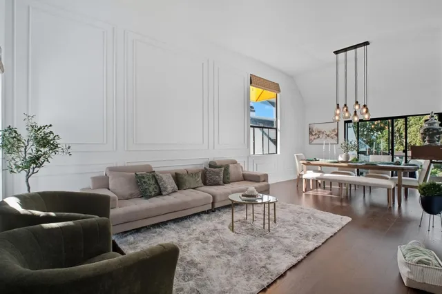 a living room with furniture and a table