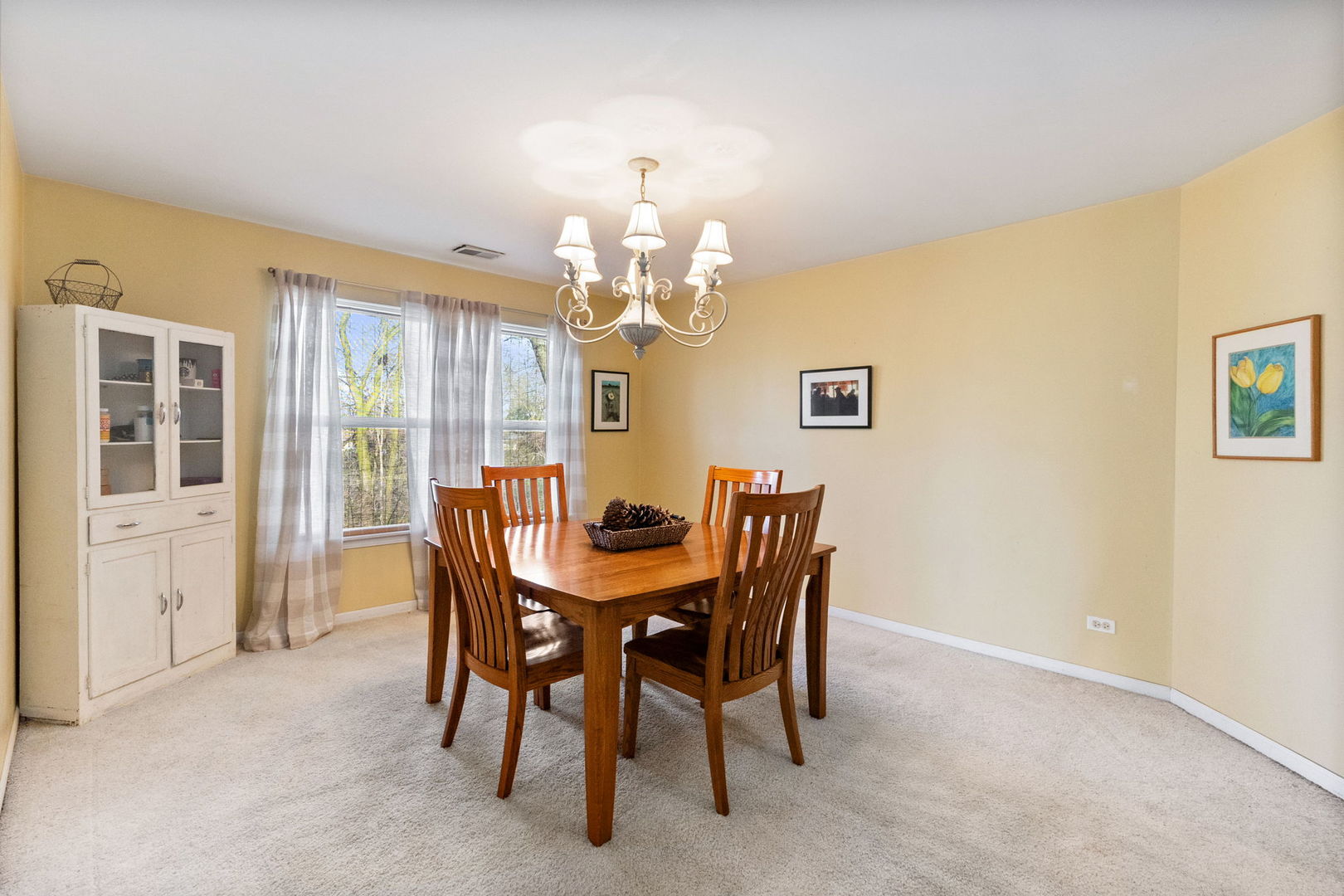 388 Ridge Road North Aurora, IL 60542 - Photo 7 of 15 a view of a dining room with furniture and chandelier