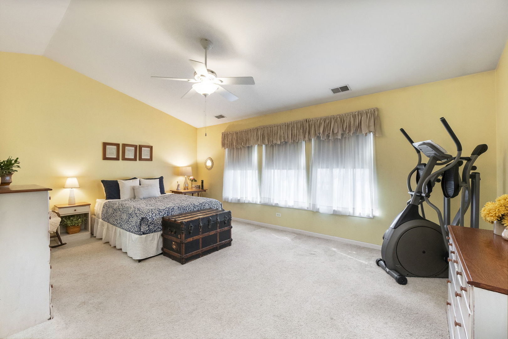 388 Ridge Road North Aurora, IL 60542 - Photo 8 of 15 a spacious bedroom with a bed and a chandelier