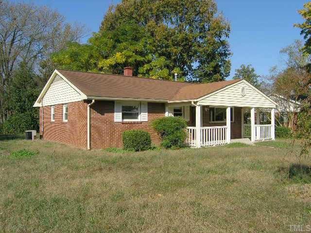 1916 Hadley Road Raleigh, NC 27610 - Photo 1 of 11 a front view of a house with a garden